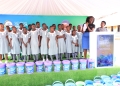 Dorothy Awori, team leader at Malaika Reusable Sanitary Pads, speaks during the launch of the "Keep a Girl in School" project in Hoima, Uganda. The initiative, in partnership with EACOP, aims to provide reusable sanitary pads and hygiene supplies to 1,000 schoolgirls across five districts